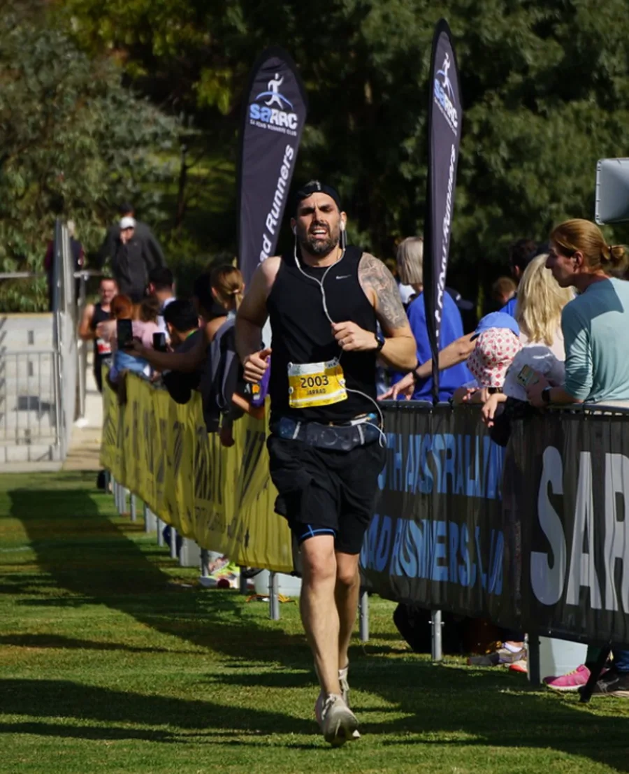 Jarrad Goulding running solo during training, exemplifying the daily discipline and consistency required for marathon success